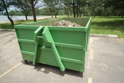 Team assessing and collecting construction debris for clearance